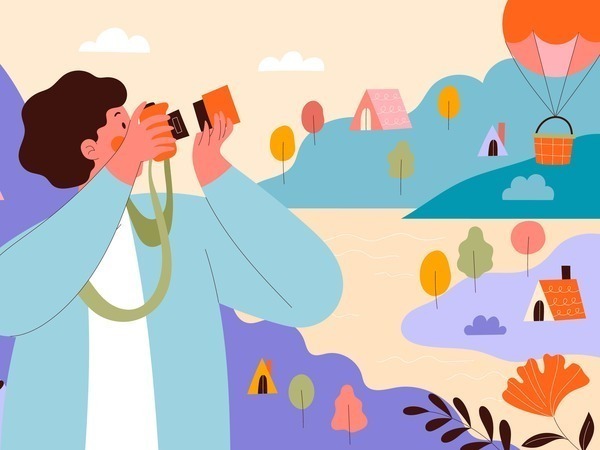 Plaatje van een persoon met een fotocamera