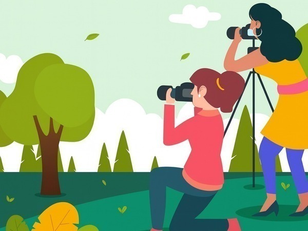 Plaatje van 2 personen die fotograferen